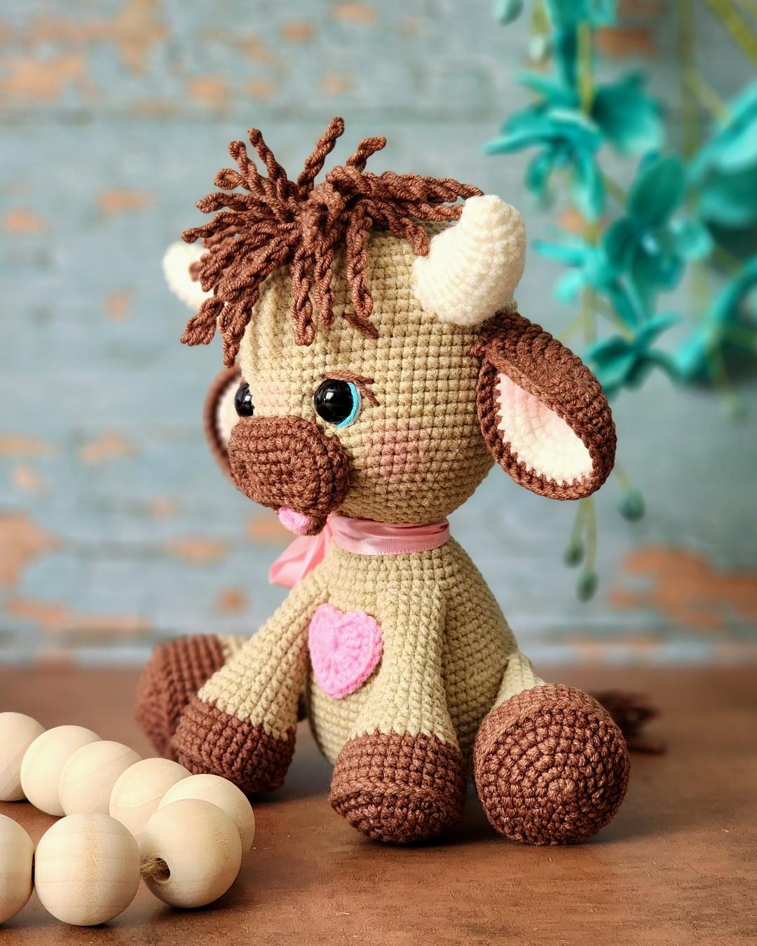Side portrait of a wheat and chocolate tester-made Olly with a pink ribbon