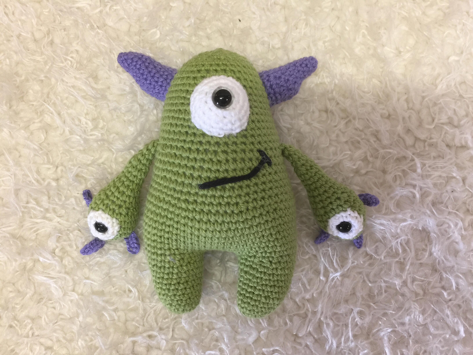 Soft green crochet Quill with lavender horns and hands